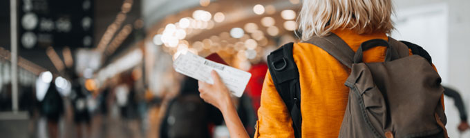 women travelling with plane ticket